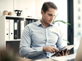 Man looking at his tablet